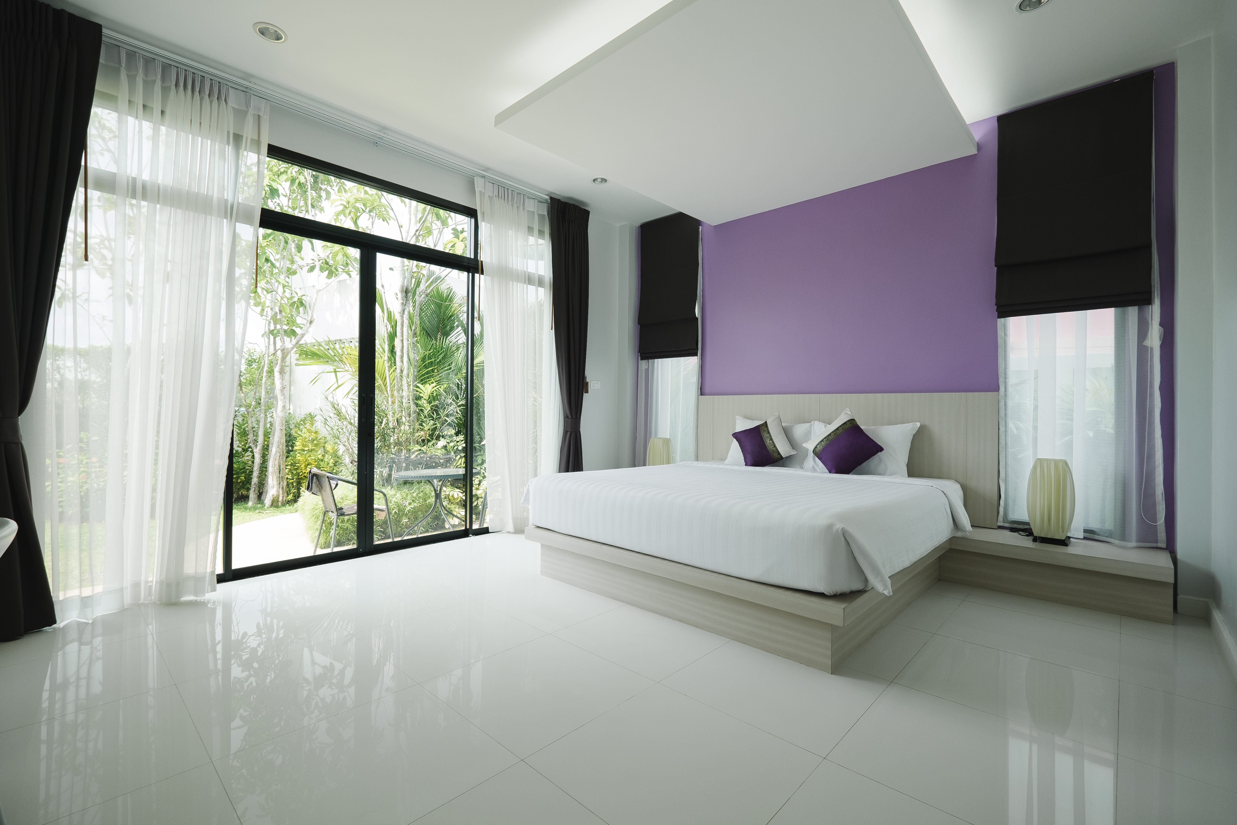 Neat and tidy bedroom with made bed